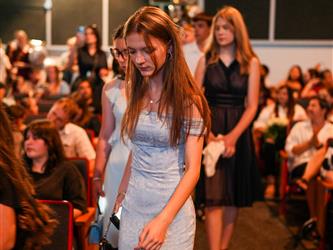 student walking toward stage