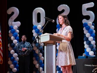 student speaking at podium