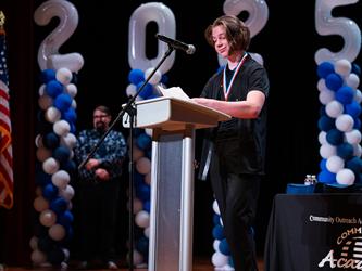 student speaking at podium